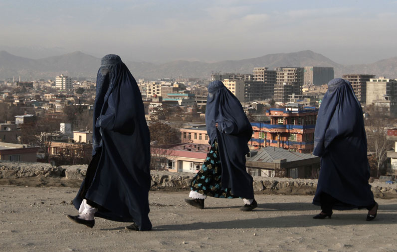 Women walk along on the street in Kabul, Afghanistan, last week. The country faces many changes next year, including a presidential election and the withdrawal of U.S. combat forces. There are also concerns that advances made by women over the past decade could be in jeopardy.